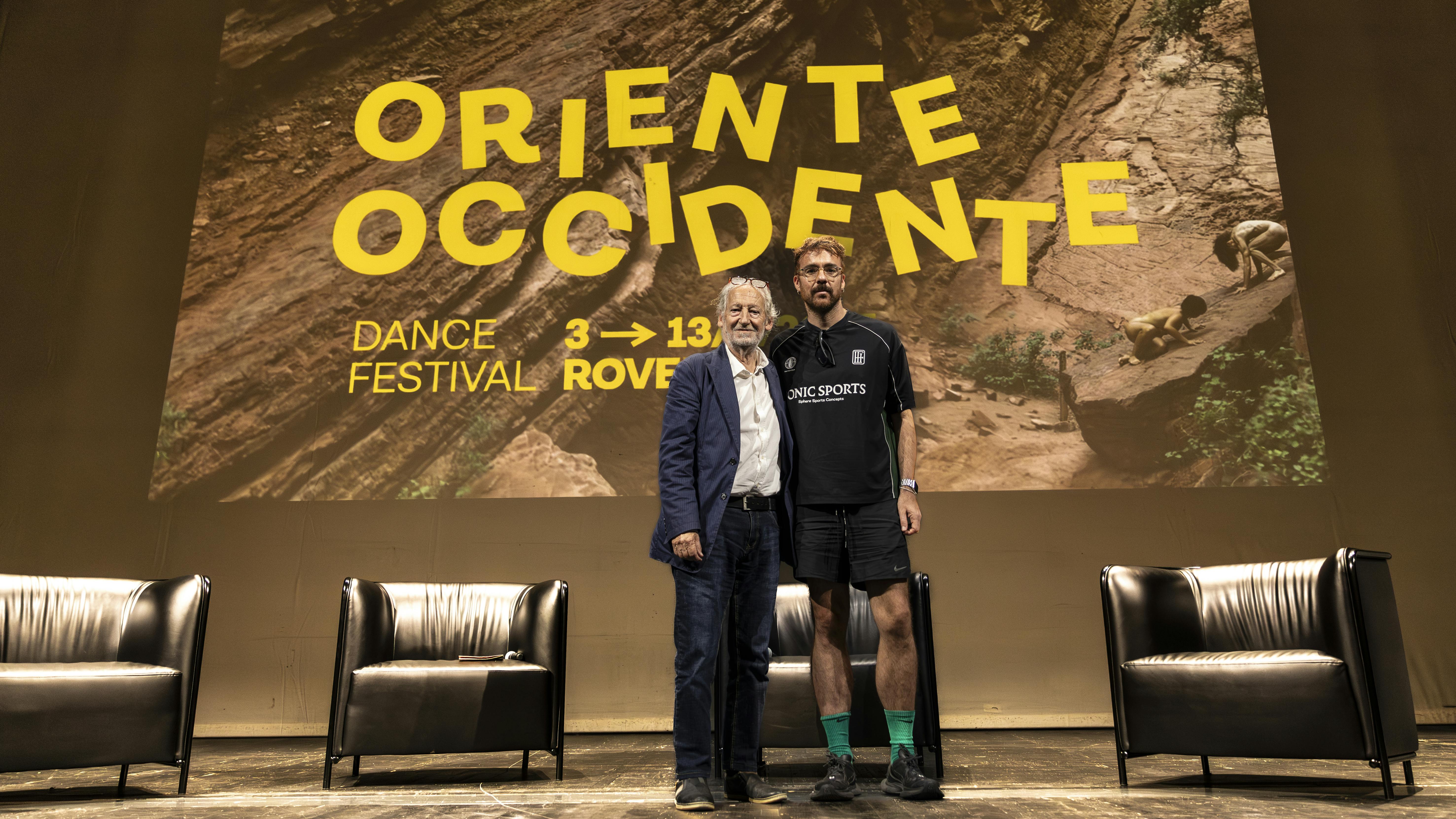 Press conference, 13 September 2025, Marcos Morau and Lanfranco Cis | photo by Monia Pavoni Marcos Morau and Lanfranco Cis, with the image of the 45th Oriente Occidente Dance Festival in the background