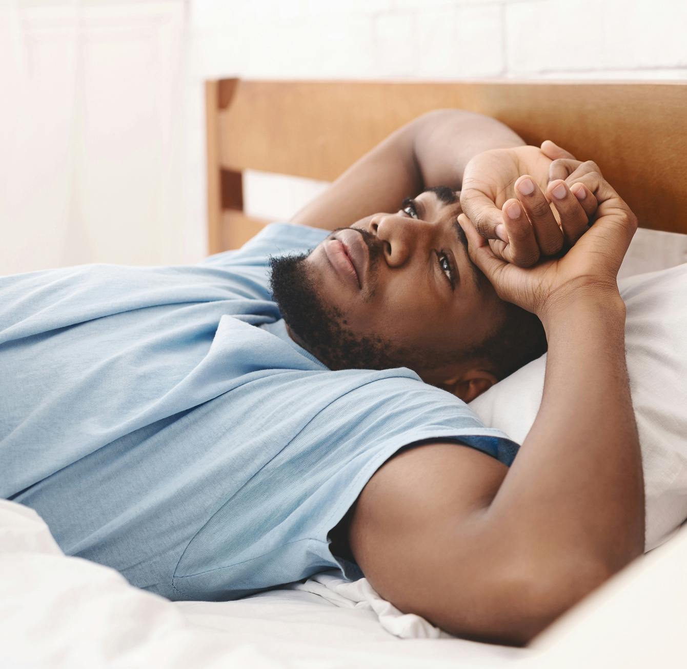 Man struggling to sleep