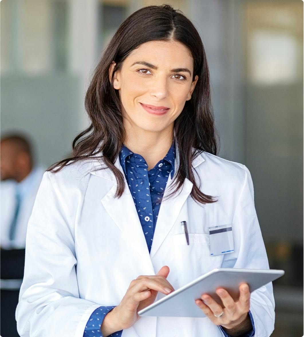 Female physician smiling at the camera