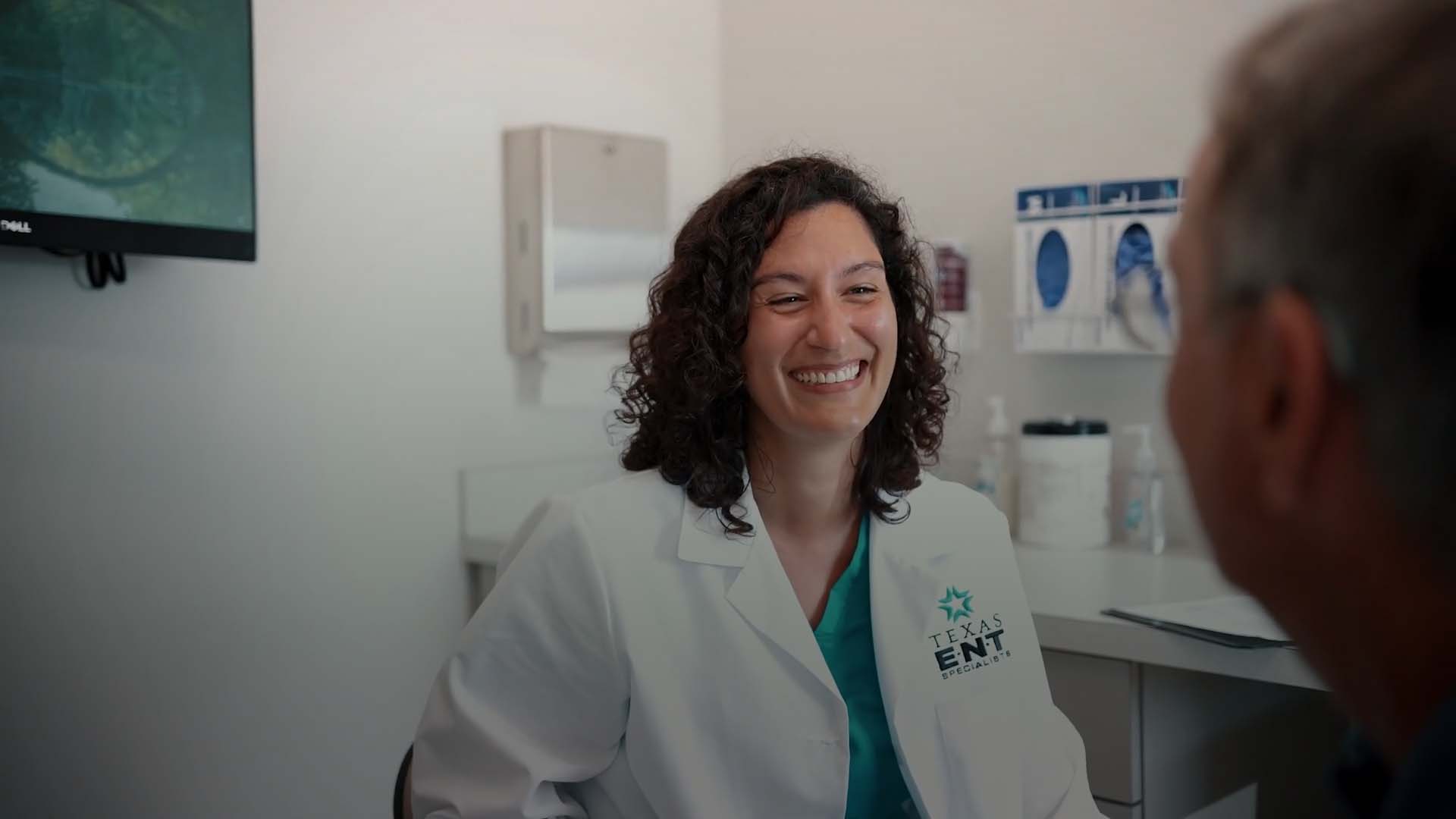 an image of a doctor smiling at a patient