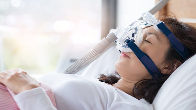 Woman with CPAP machine