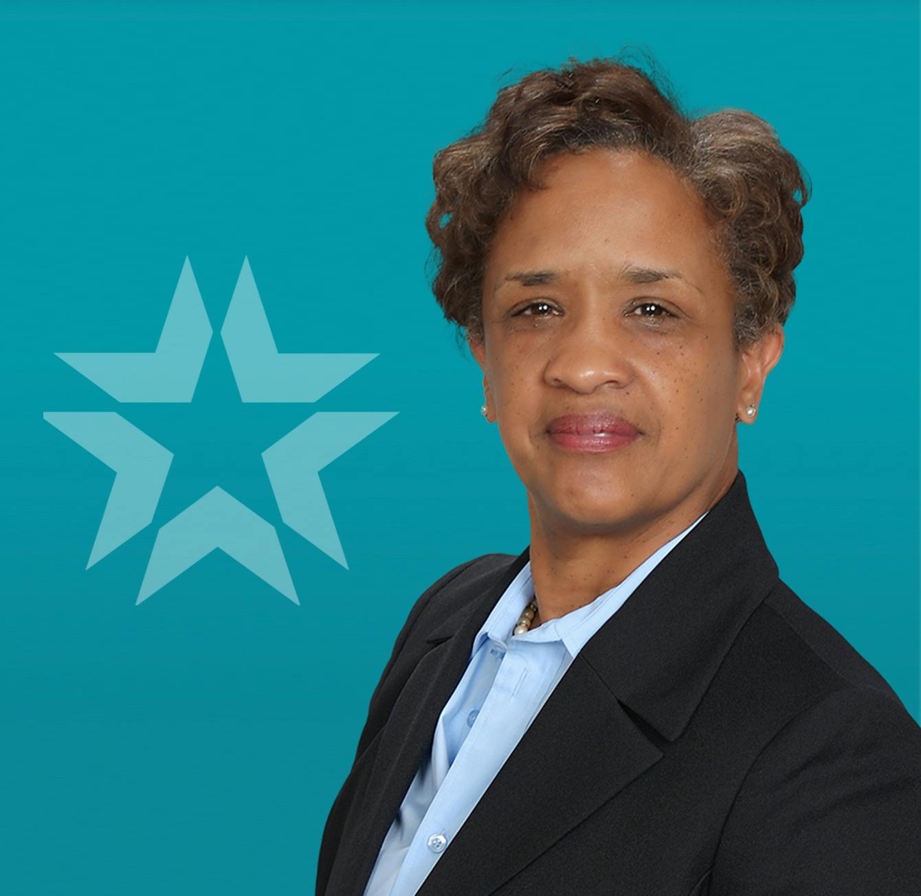 tyra joseph headshot with blue background