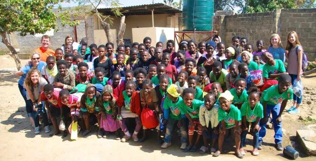 an image of a group of children in green shirts