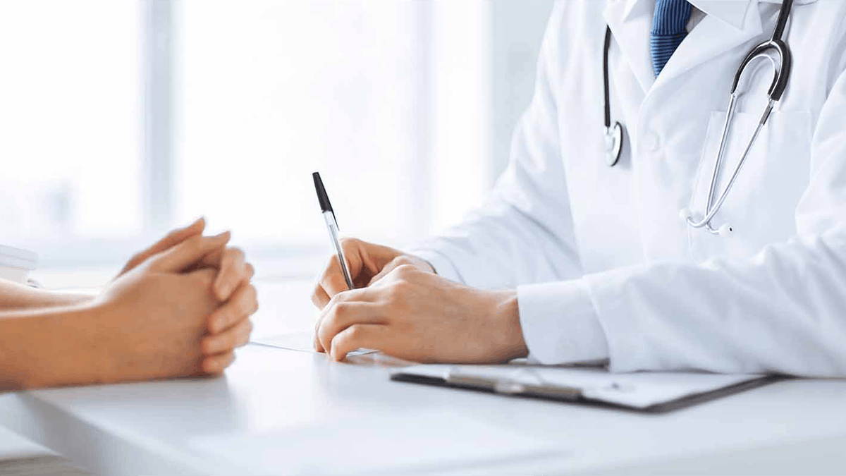 close up of a doctor writing a prescription