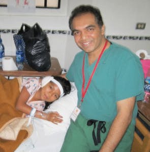 an image of dr manish with a patient