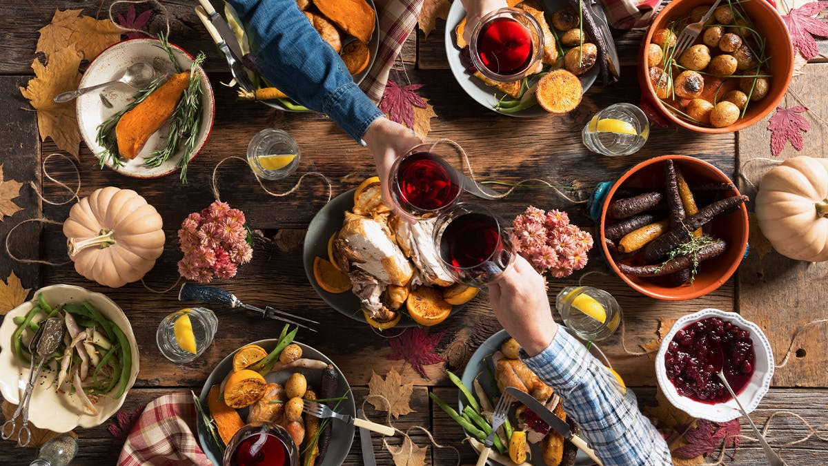 a dining table with a lot of fall food