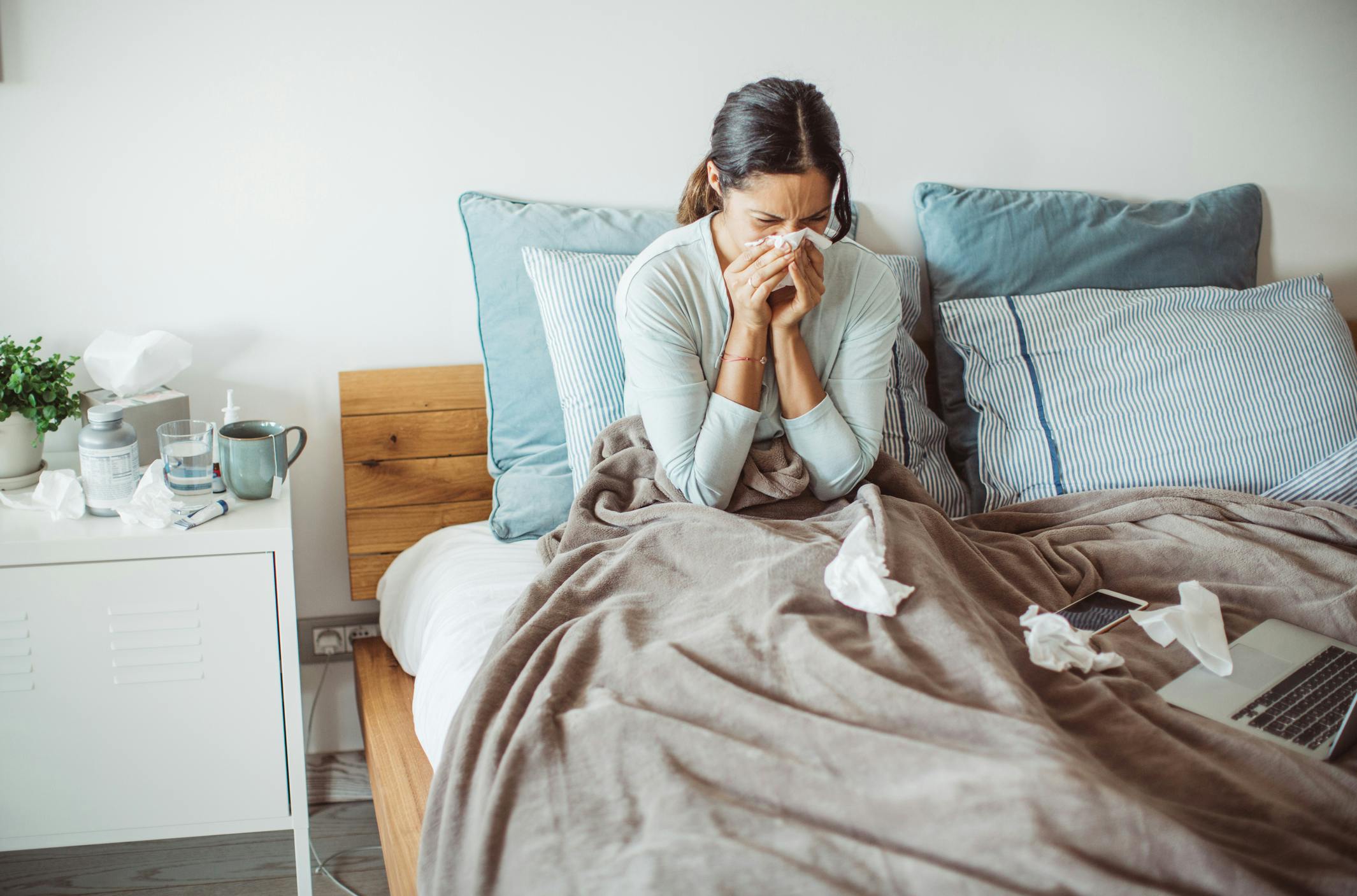 Woman sick in bed