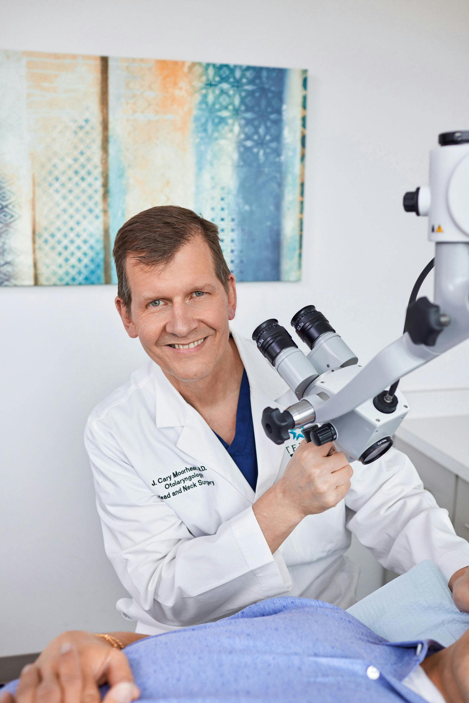 doctor about to look into a microscope