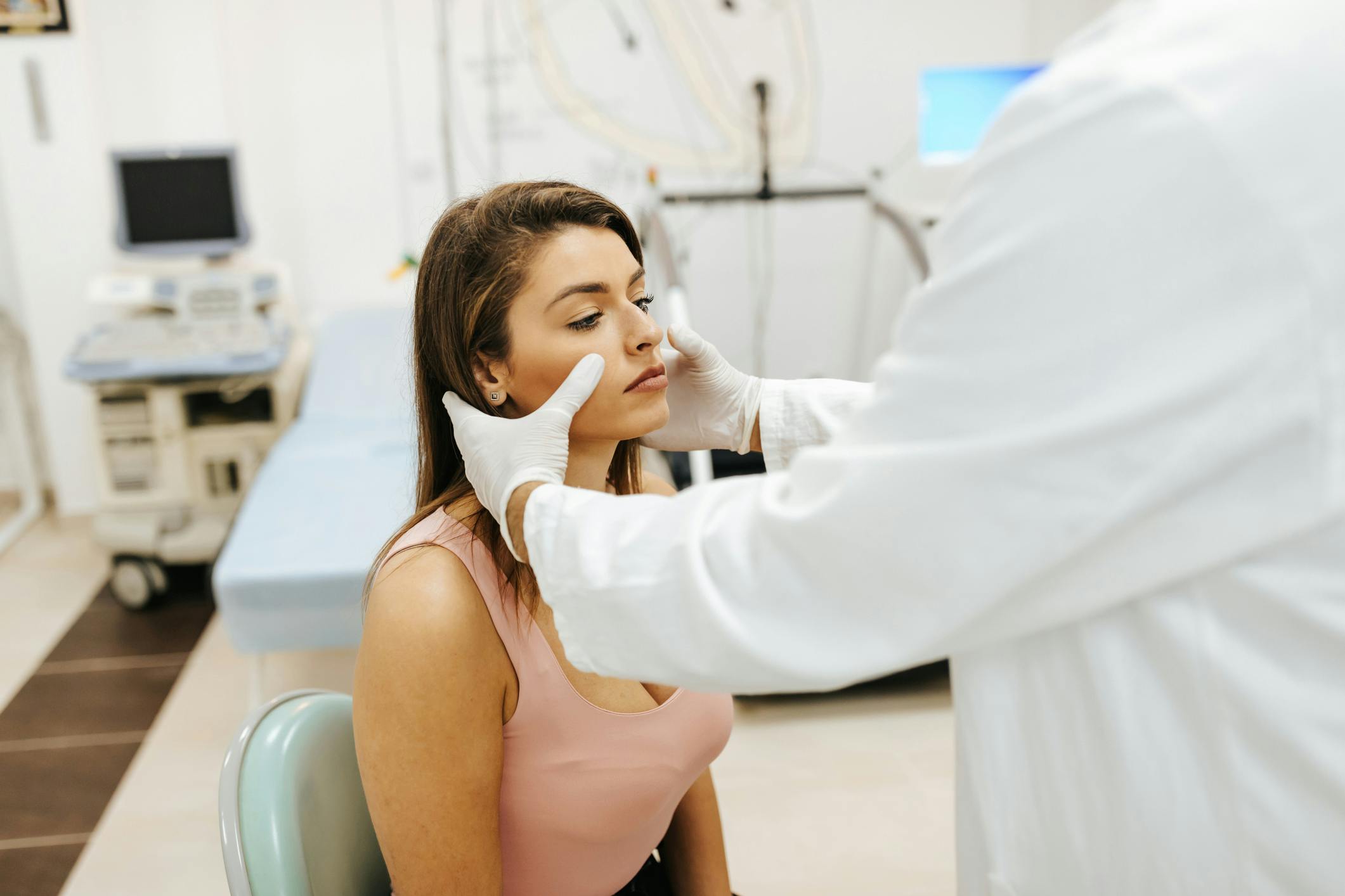 woman's sinuses being evaluated