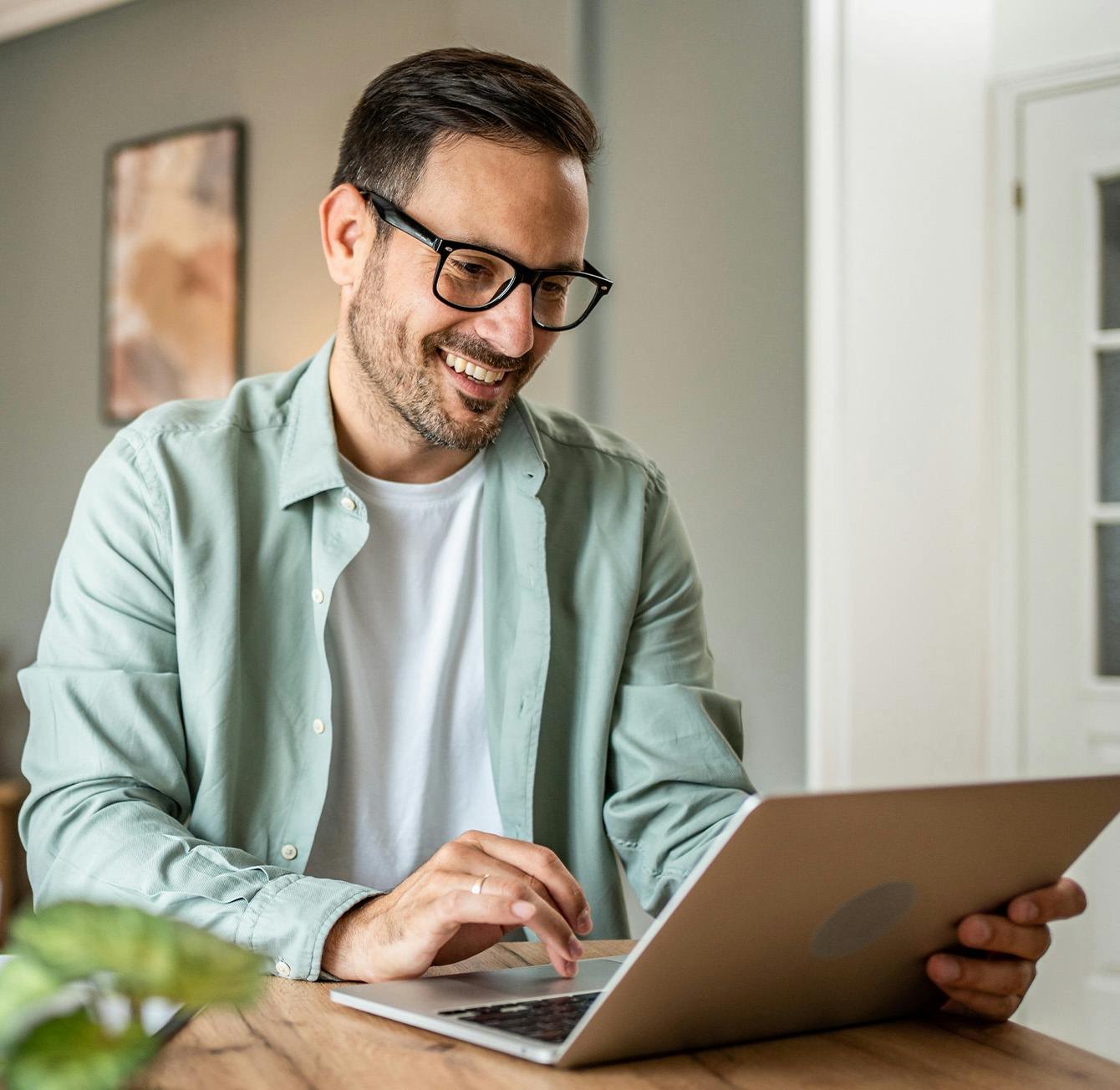 Man on laptop smiling