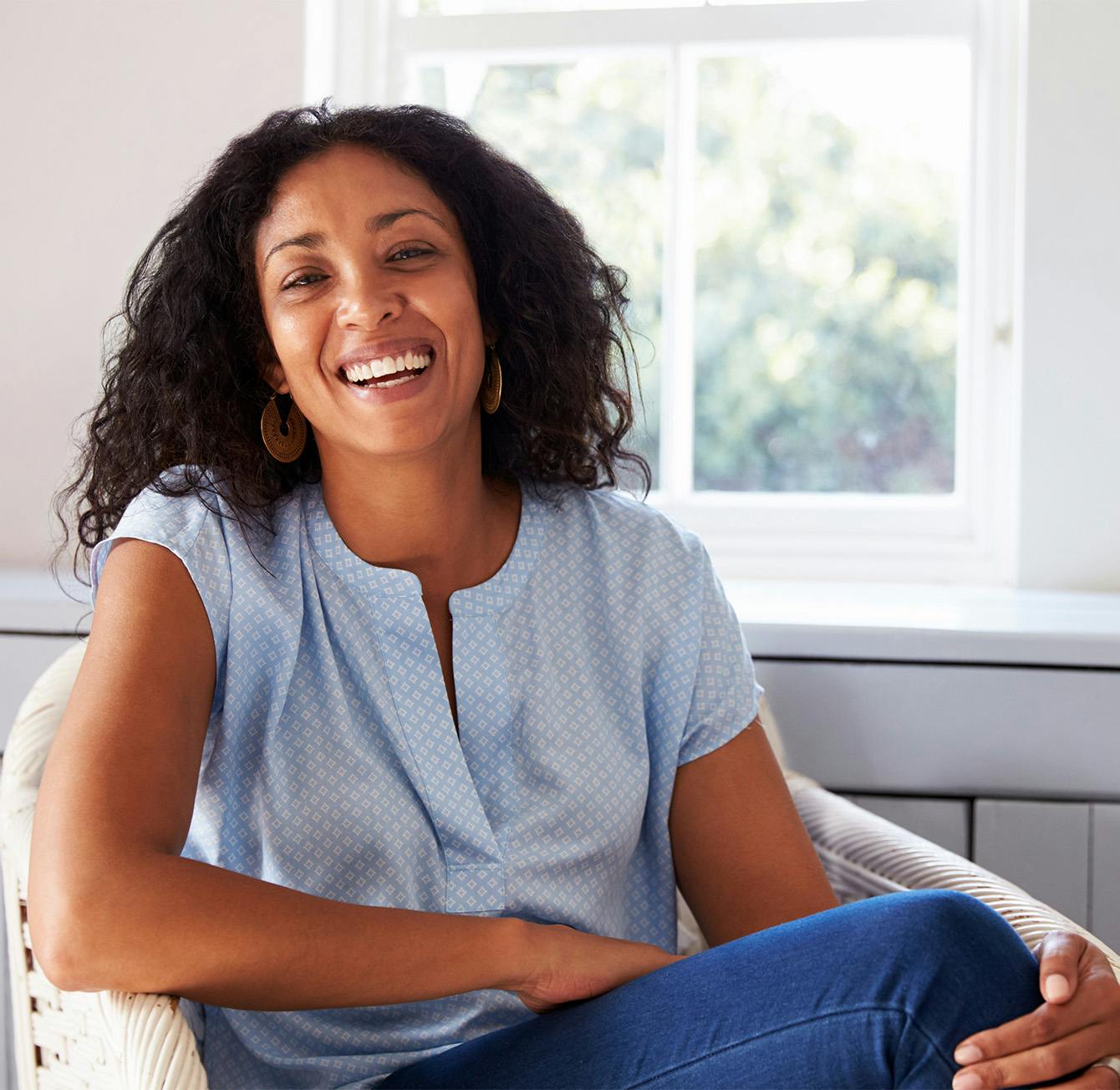 Woman sitting and smiling