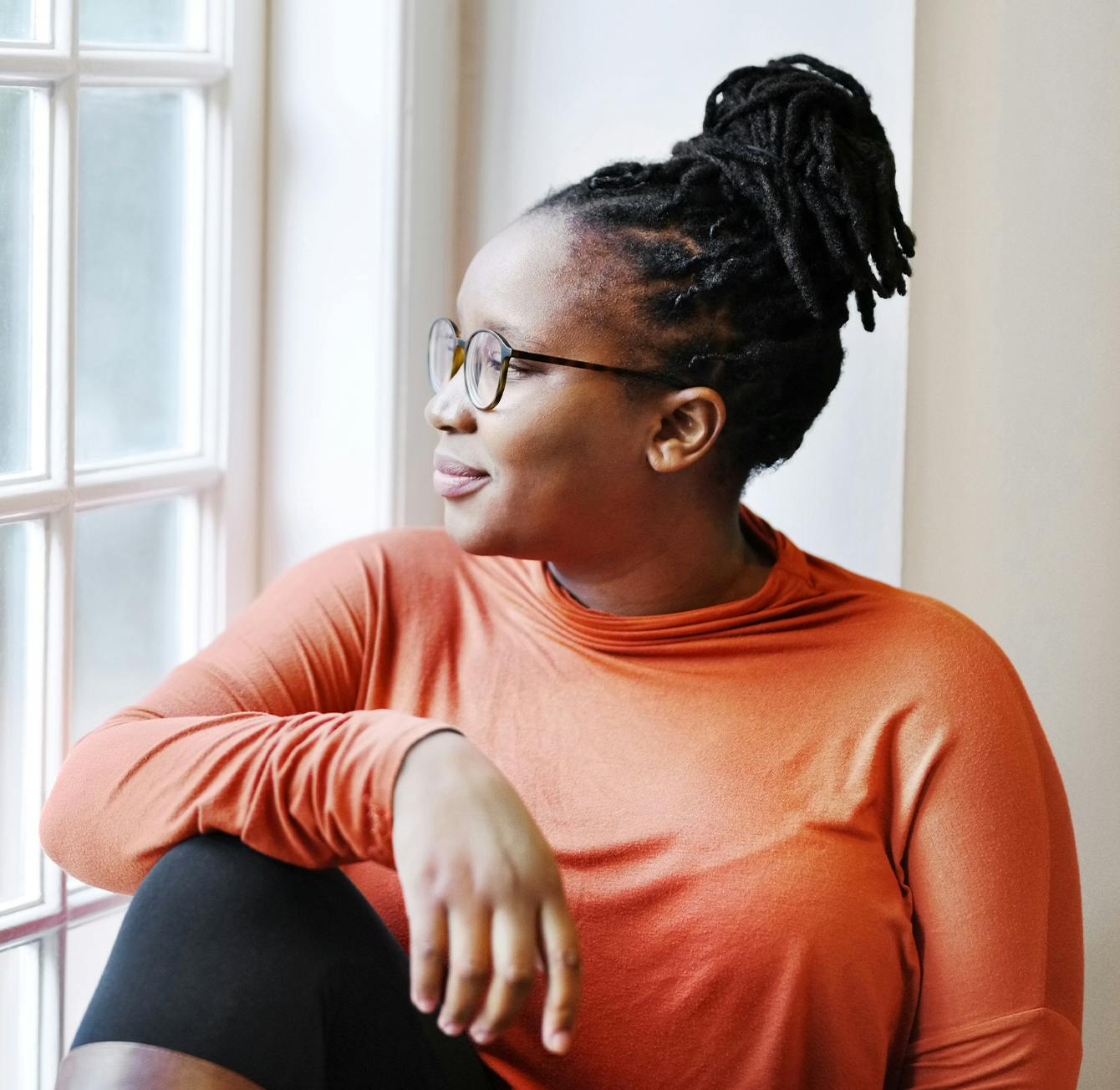Woman looking out window