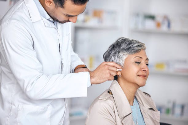 Woman Receiving Cochlear Implants