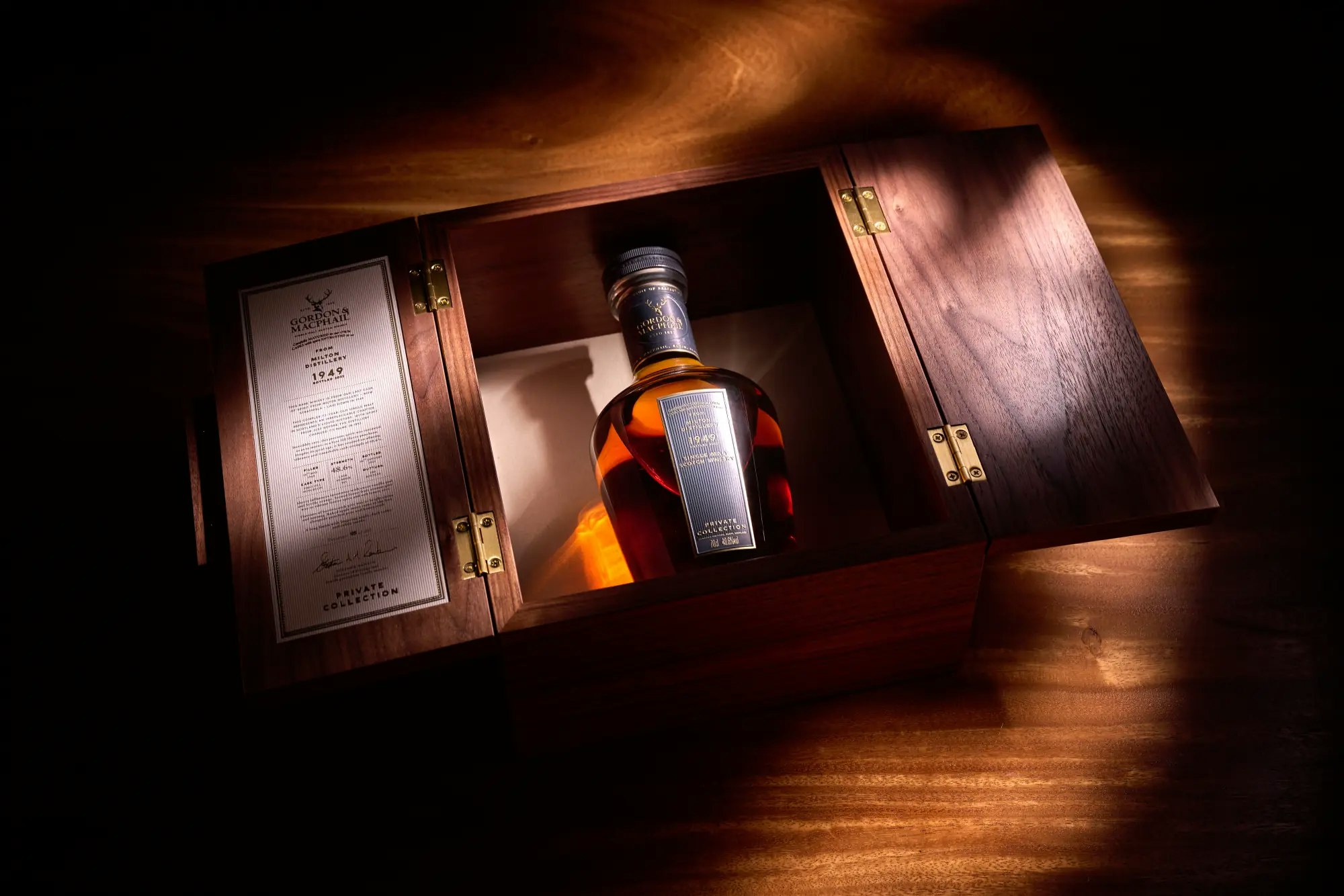 A rare bottle of whisky in its original wooden case