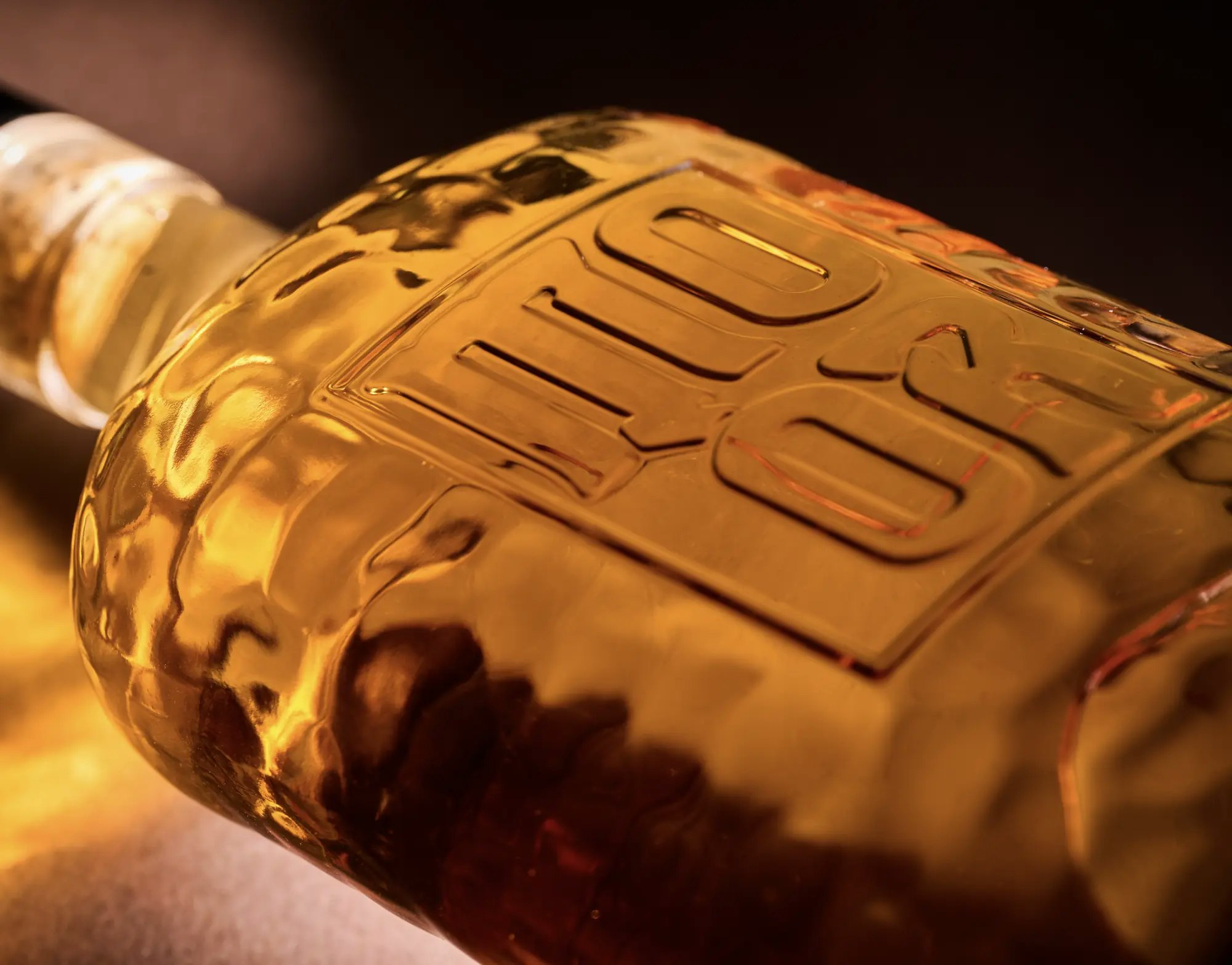A MO ÒR bottle in low light
