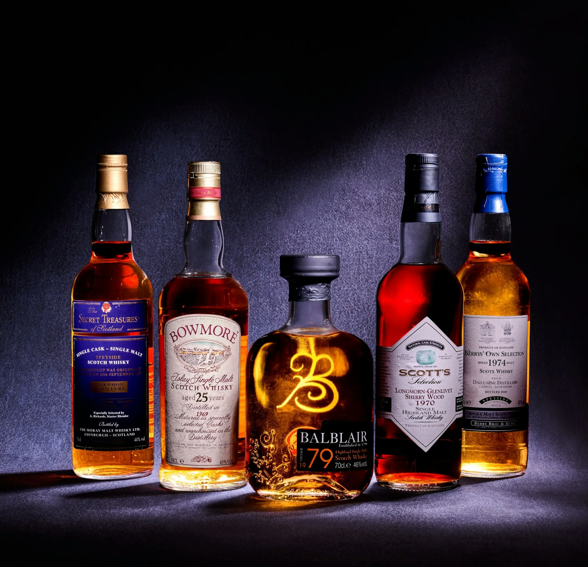 Five rare whisky bottles from different distilleries lined up