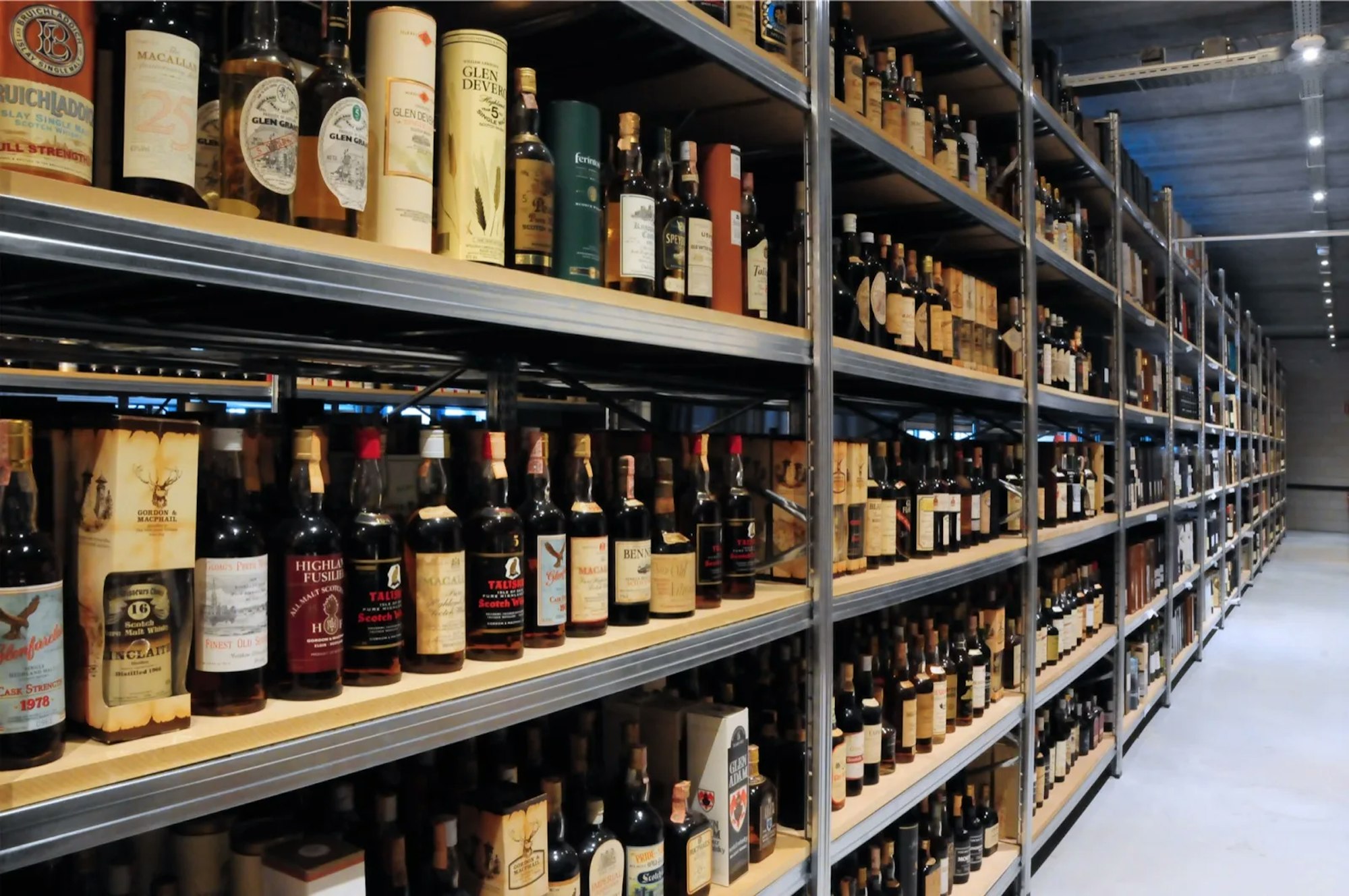 Long shelves full of whisky bottles