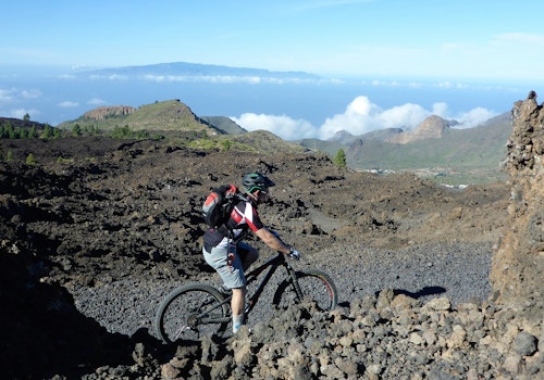 Mountain biking on the volcanoes (Arenas Negras) in the Teide National Park, Tenerife