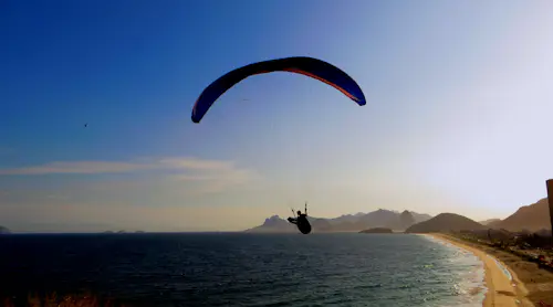Tandem paragliding in Cape Town, South Africa with sea and mountain views