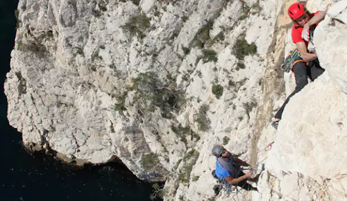 Beginners’ rock climbing by the sea in the Calanques, near Marseille
