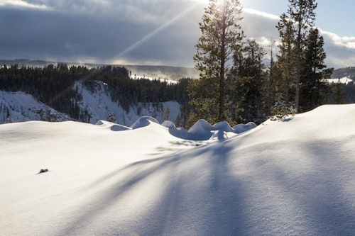 Backcountry skiing and snowboarding day tours in Yellowstone, Montana, with a guide