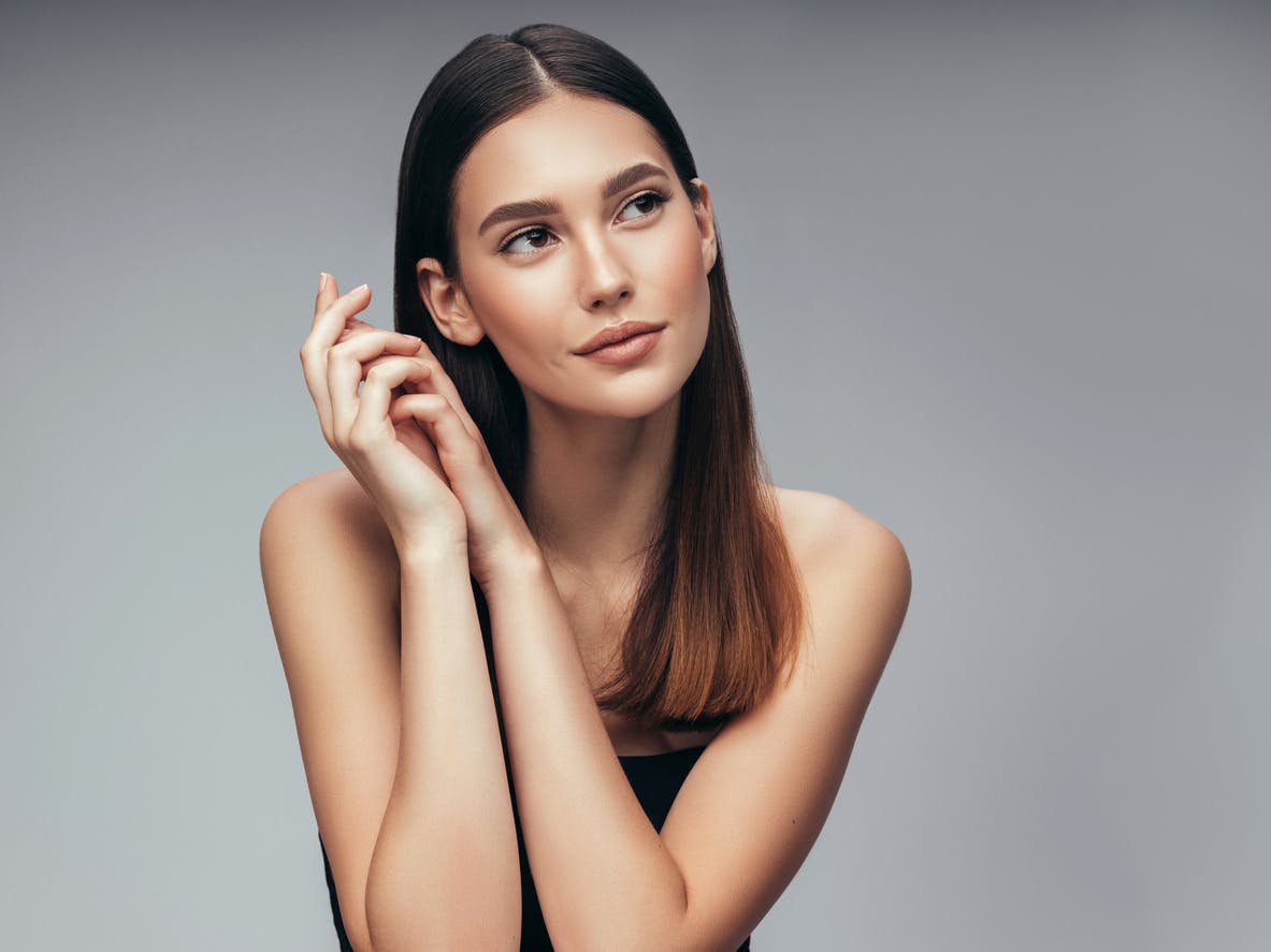 Pretty Women With Darker Hair Looking Towards The Side