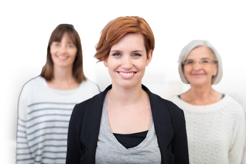 Three women stand next to each other smiling