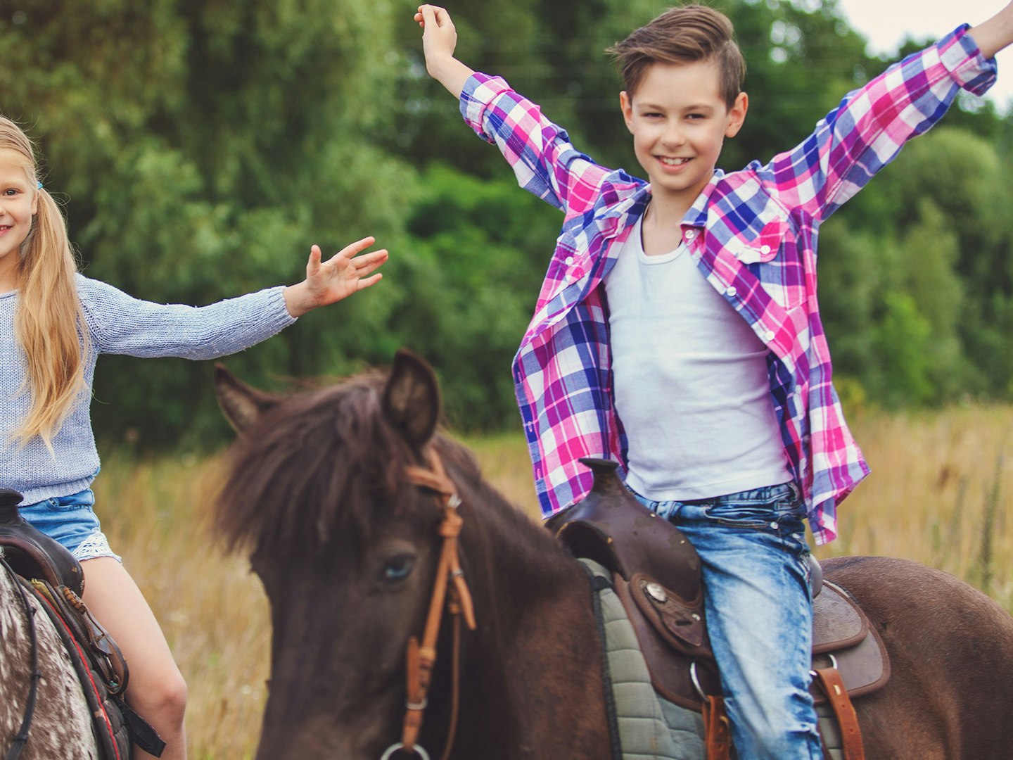 Children riding horses