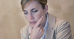 woman in pantsuit contemplating life