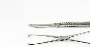 surgical scalpel and clamp