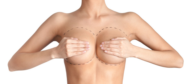 woman holding both her breasts in her hands
