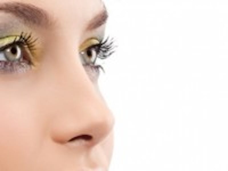 woman with green colored eye shadow