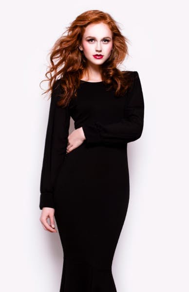 Attractive woman with red hair and black dress