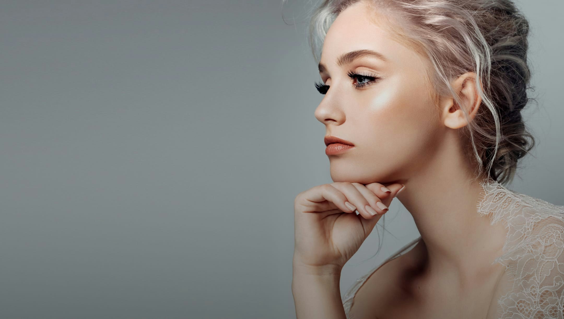 Beautiful model resting chin on fist