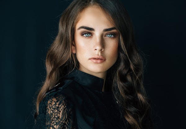 Younger model with dark hair and blue eyes