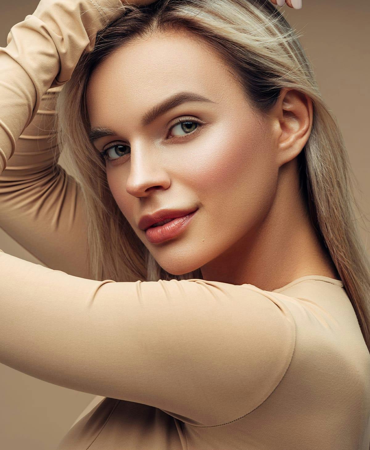 Younger woman with blonde hair and prominent lips