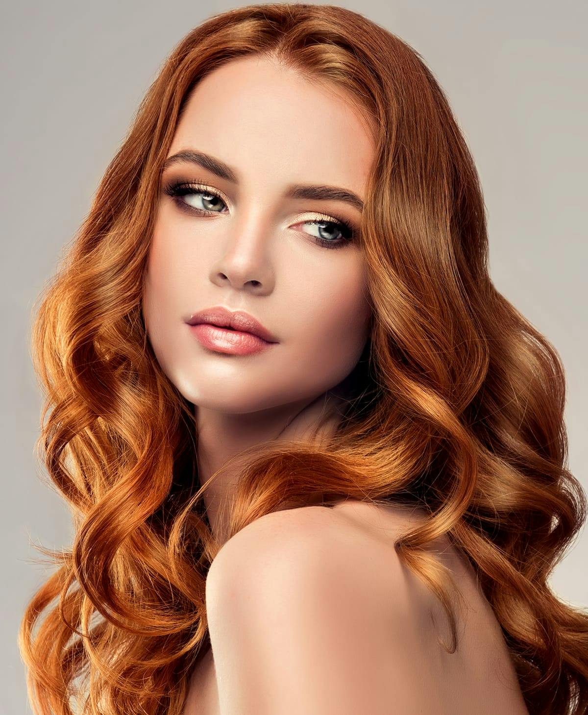 Red-haired woman with glowing skin