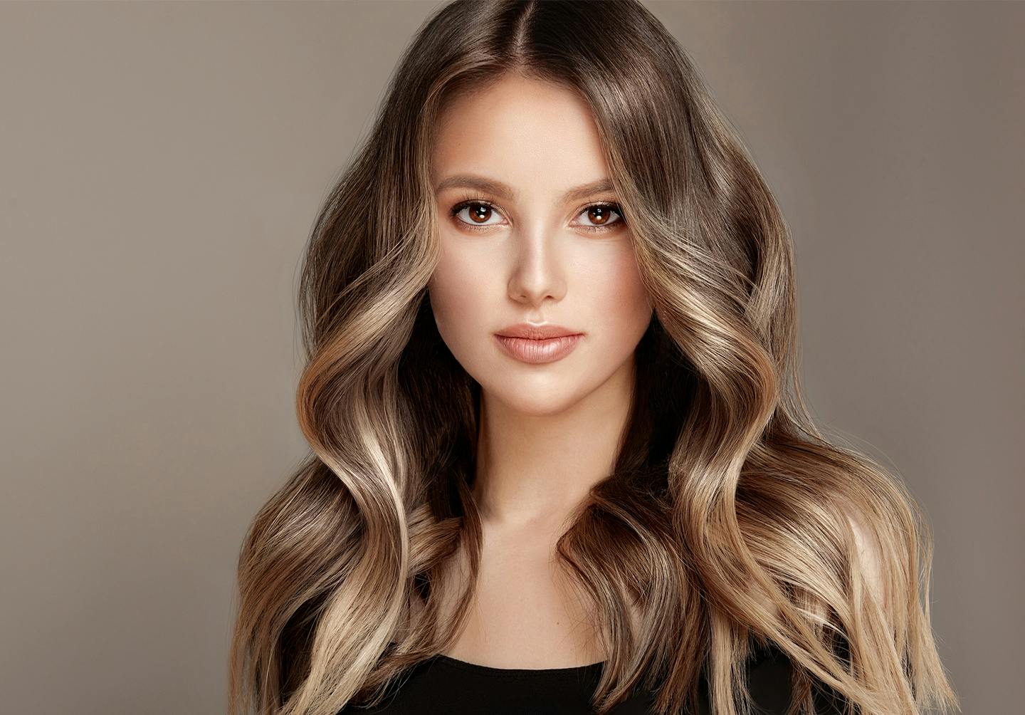 woman with wavy dark blonde hair