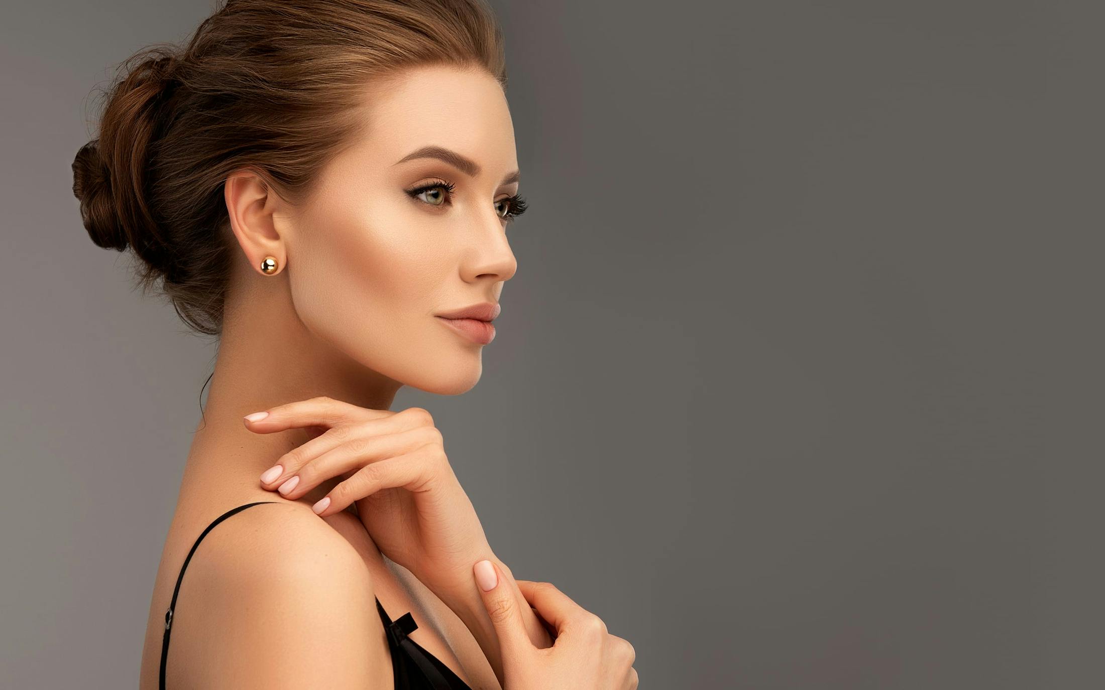 beautiful woman with hair pulled back in a bun