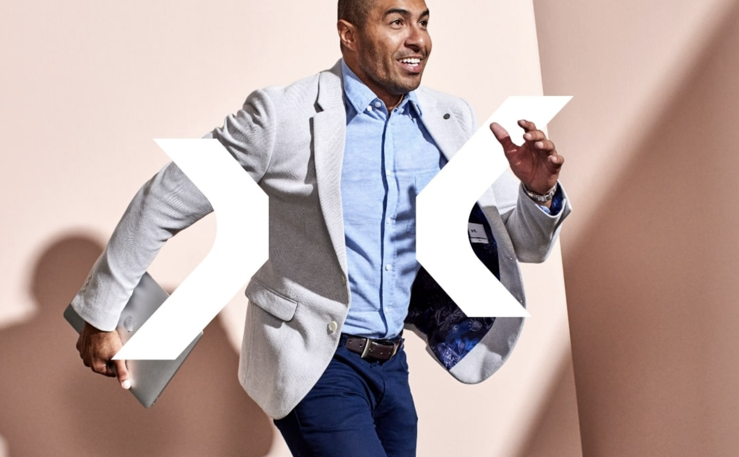 A man dressed in business clothes with the Bankstown Exchange logo incorporated