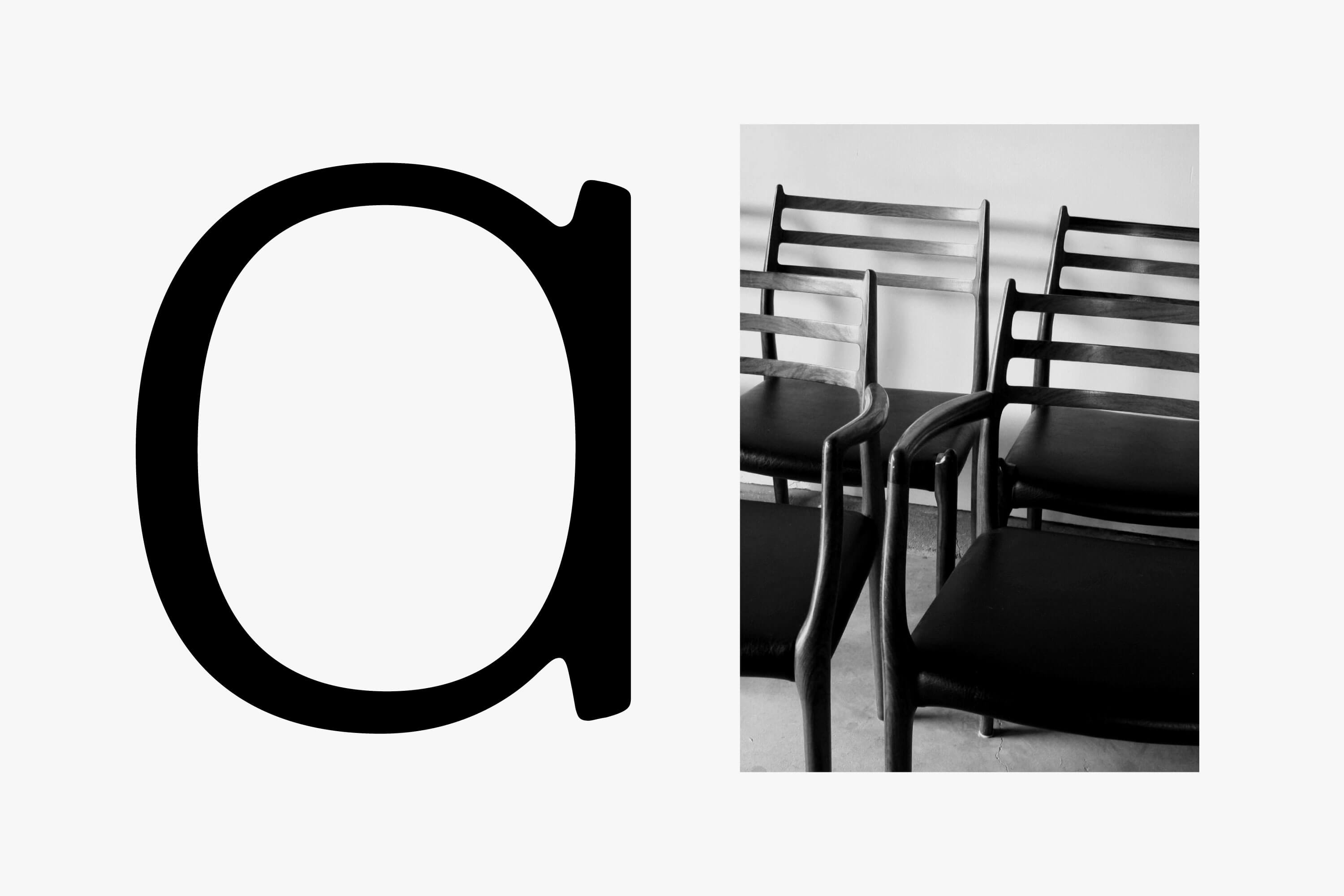 bespoke letter 'a' in black writing and black and white image of chairs