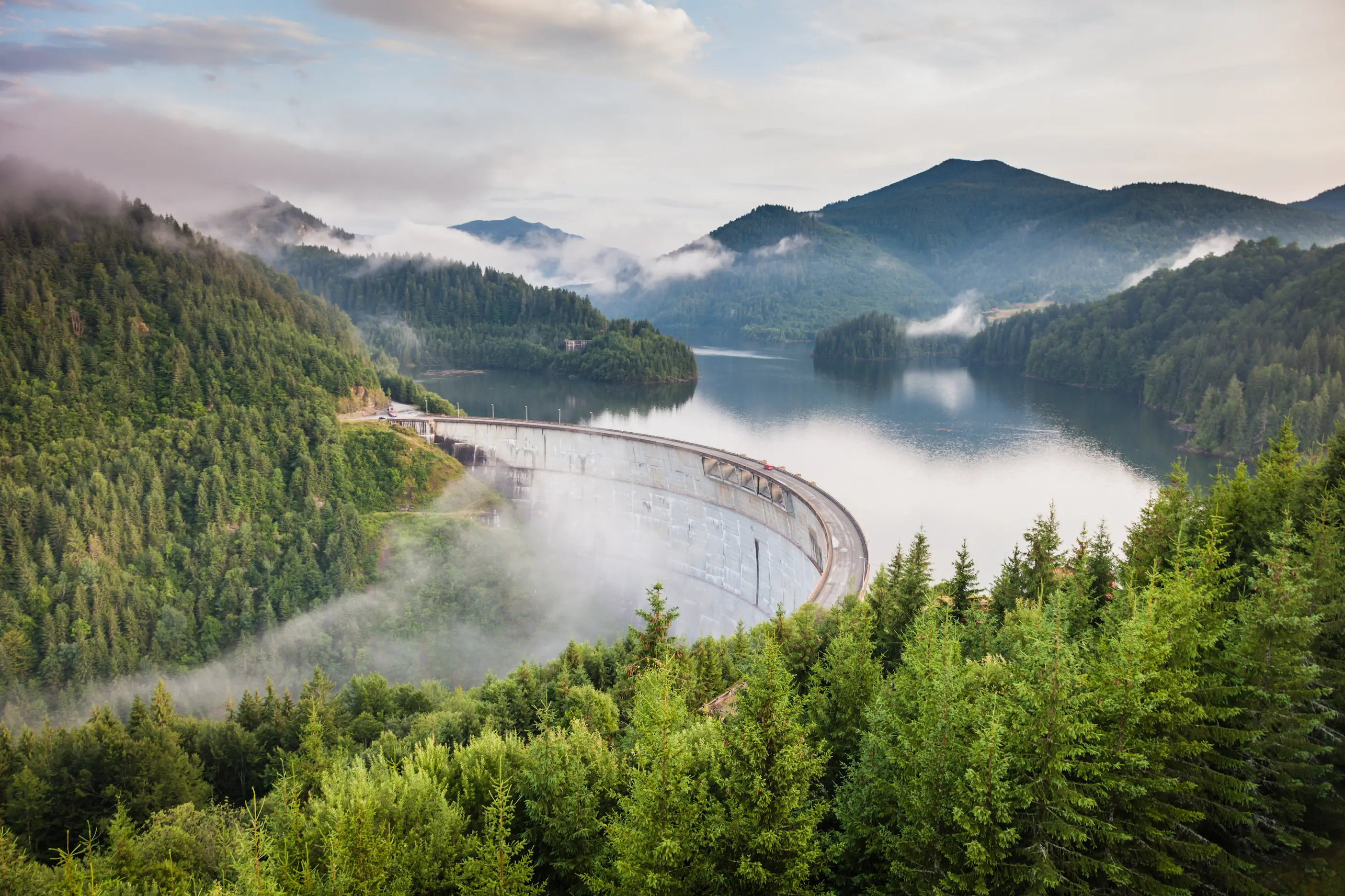 Dam in mist. Photo by Paul Mocan on Unsplash