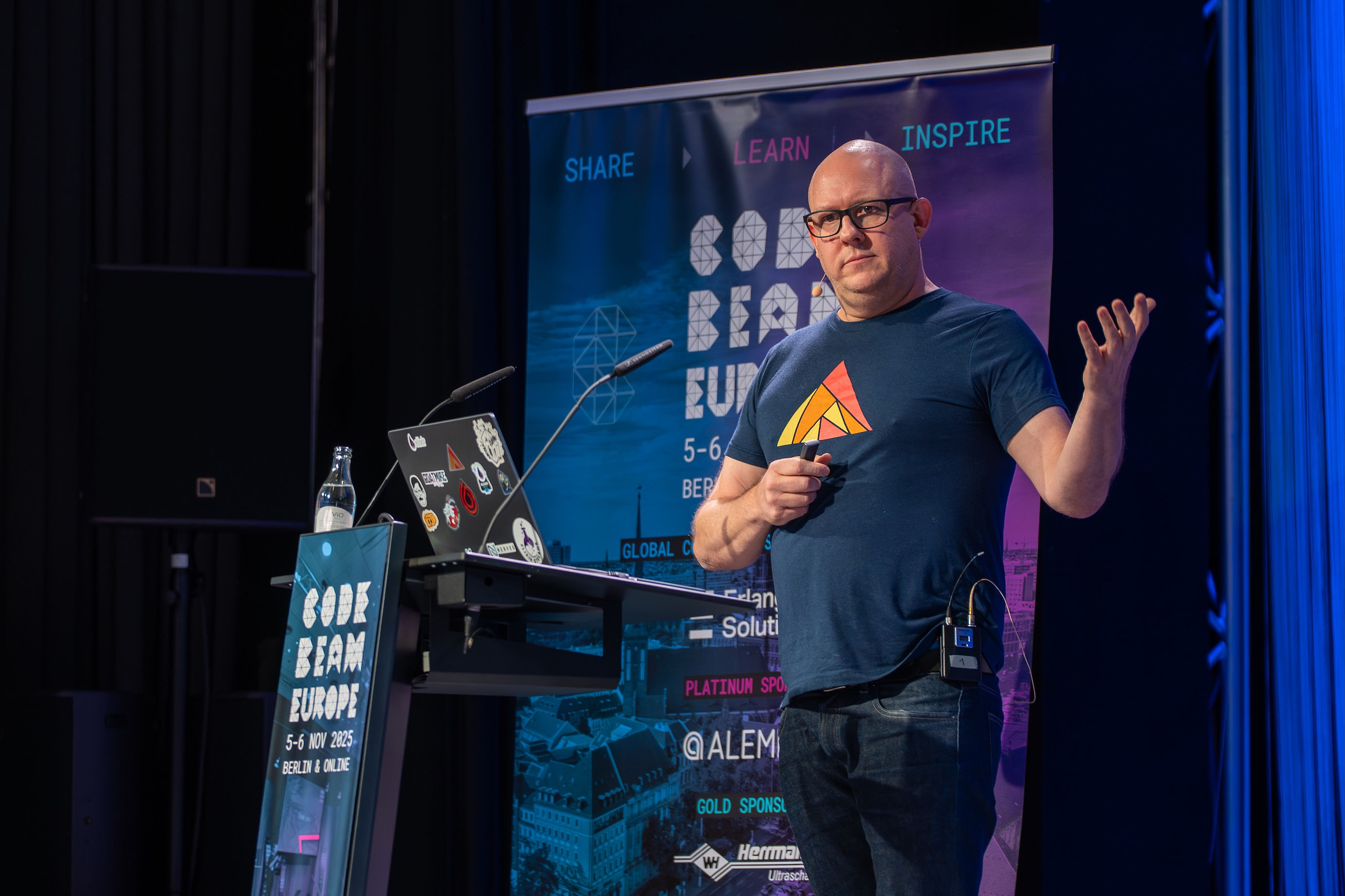 CodeBEAM EU 2025 - Josh Price on stage delivering his keynote. Photo by CodeSYNC