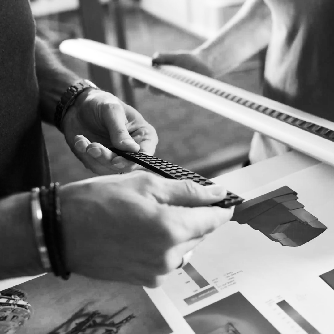 Close-up on hands holding profiles in grey scale