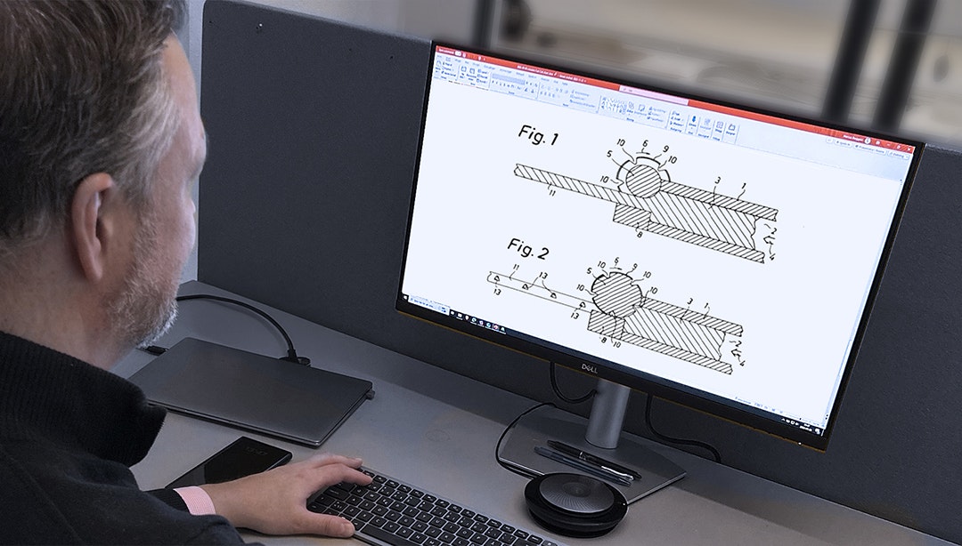 Man looking at cross section process on computer