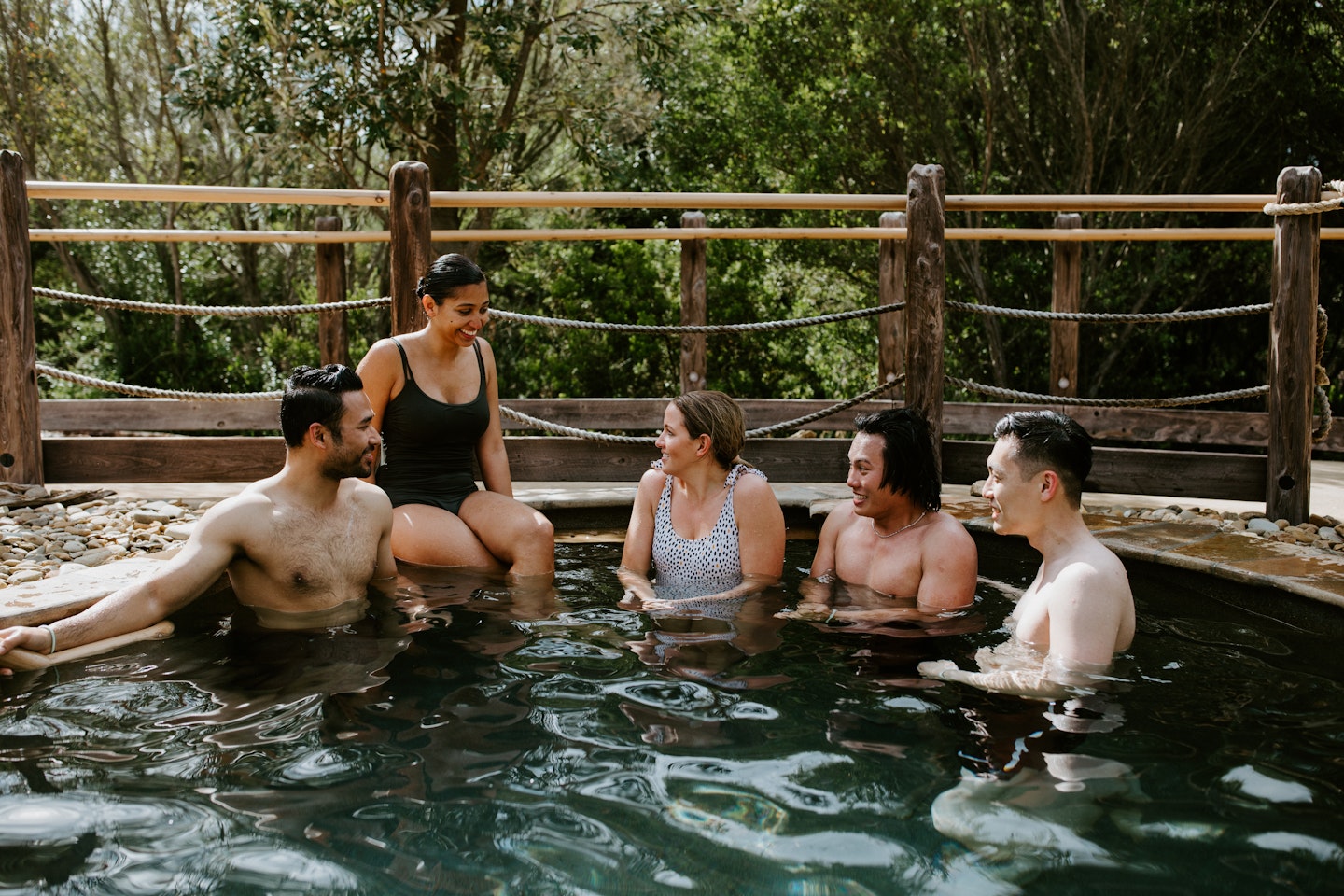 friends sitting in cold plunge pool