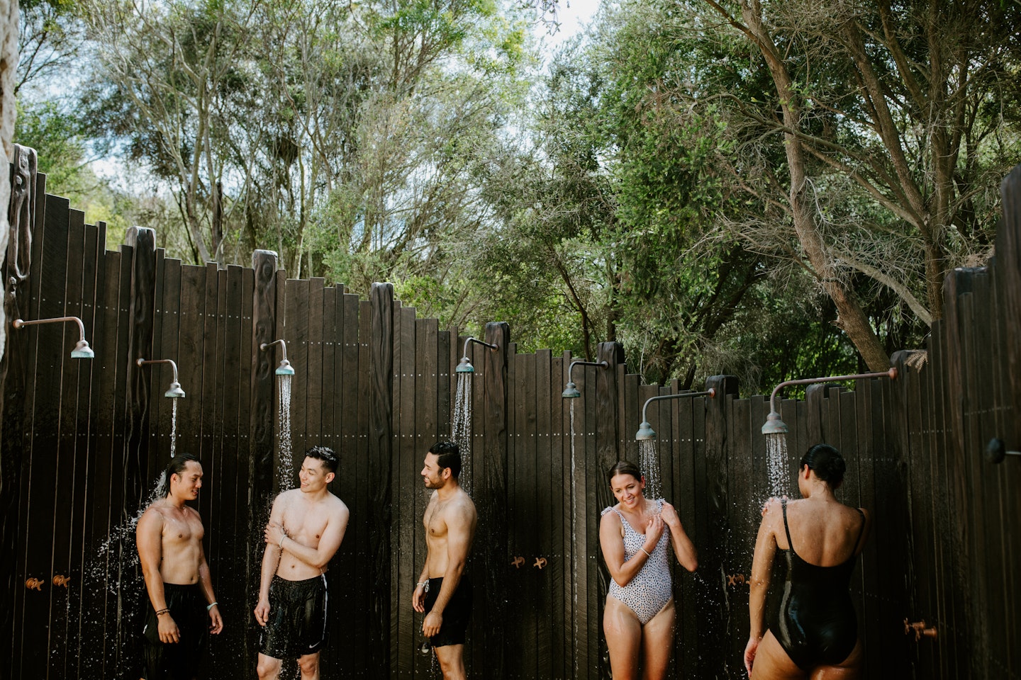 group of friends under shower