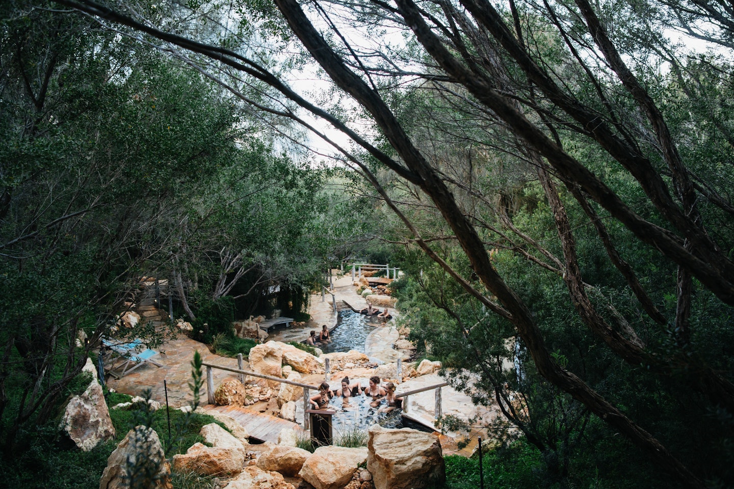 friends gathered in a geothermal pool
