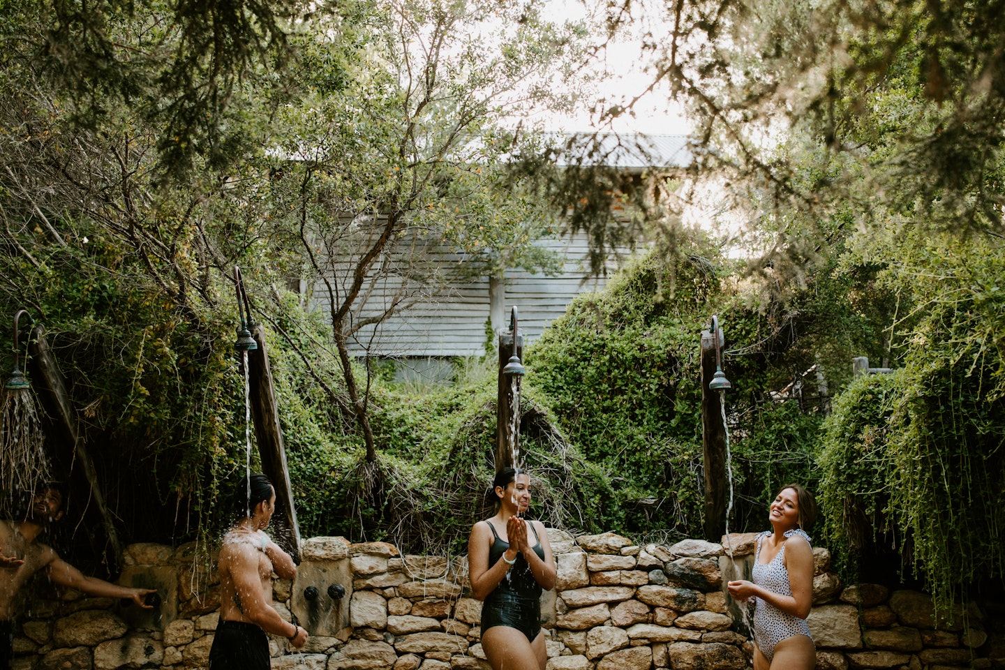 people in bath house showers