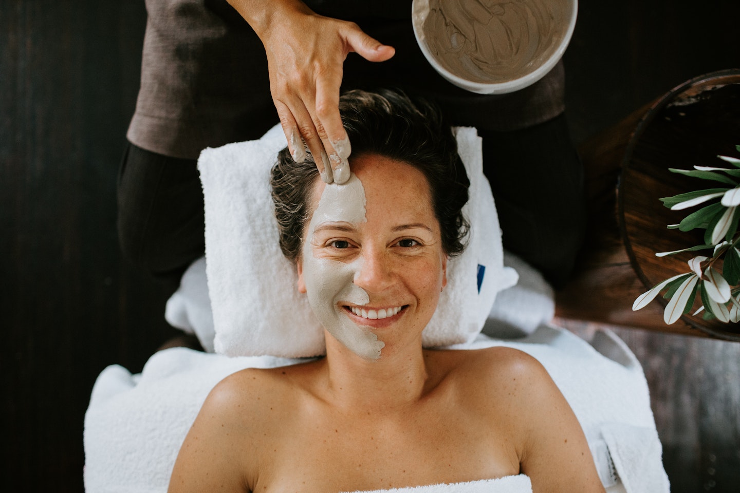 girl smiling during a facial